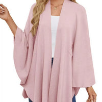 Blush pink cape shawl with long draped sleeves, open front, and front tie at waist