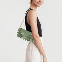Green camouflage shoulder bag on gold chain with white strap, side profile view.