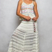 Cream and blue printed cami with V-neck, button placket, and trim detail