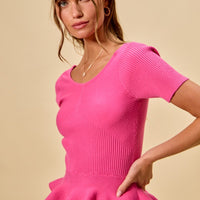 Hot pink ribbed knit peplum sweater top with ruffled peplum hem