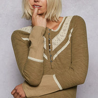 Olive ribbed knit top with half-button placket and white lace V trim