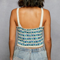 Back view of crocheted cropped cami with scalloped edge, thin white straps