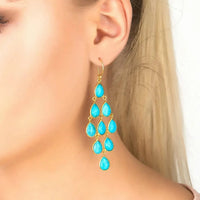 Gold-tone turquoise teardrop drop earrings with dangling cascade
