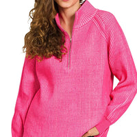 Hot pink ribbed half-zip sweater with tall collar and long sleeves