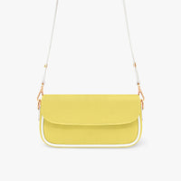 Yellow leather shoulder underarm bag with flap front and white strap with gold chain.