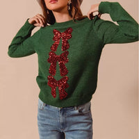 Green Christmas sweater with red sequin bow ribbon applique on front