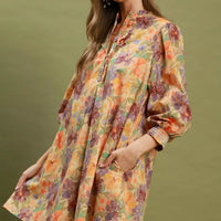 Floral print mini dress with smocked cuffs and voluminous balloon sleeves, side view