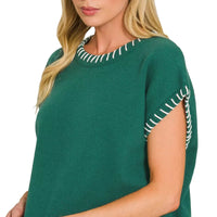 Hunter green knit oversize sweater with contrast stitch trim on neckline and sleeve edge