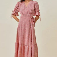 Red and white striped wrap midi dress with short puff sleeves, tiered hem, belted waist