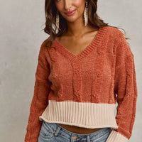 Rust chenille cable knit V-neck cropped sweater with cream contrast waistband