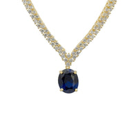 Gold tennis necklace with oval sapphire pendant