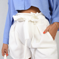 White paper bag high-waist shorts with bow tie belt and gathered waistband