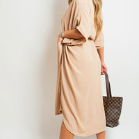 Beige button-down collared midi dress with two front pockets and relaxed tied waist