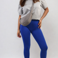 Bright-blue high-waisted ankle leggings with wide waistband, full length fit.