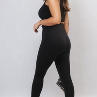 Black high-waisted ankle leggings with wide waistband, side view full length.