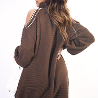 Dark brown oversized knit jumper with high neck and cold-shoulder cutouts, studded trim
