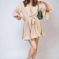Pleated mini dress with tie waist and wide sleeves, light beige