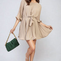 Beige pleated mini dress with tie waist and wide sleeves, gathered ruffles.