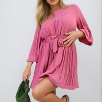 Pink pleated mini dress with tie waist and three-quarter wide sleeves