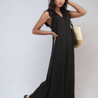 Wide-leg jumpsuit in black with V-neck and sleeveless design