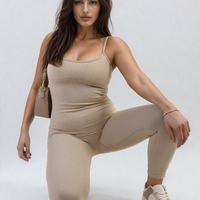 Beige fitted jumpsuit with scoop neck and thin straps, sleeveless one-piece