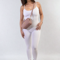 Fitted white jumpsuit with thin straps and scoop neckline, full-length front view