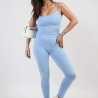 Light blue bodycon jumpsuit with scoop neck and thin spaghetti straps