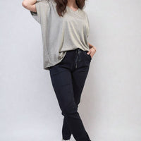 Drawstring tapered trousers in dark navy with side pockets, drawstring elastic waist