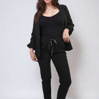 Black drawstring tapered trousers with side pockets