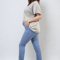 Light blue drawstring tapered trousers with side pockets and elastic ankle cuffs