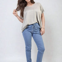 Blue drawstring tapered trousers with side pockets and adjustable waist drawcord
