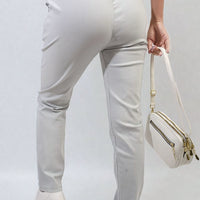 Drawstring trousers in light cream, tapered legs, side pockets, elastic waist
