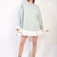 Mint oversized long-sleeve dress top with contrast ruffle hem, front view