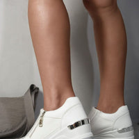 White platform trainers with rhinestone detailing, side zip and metallic heel tab