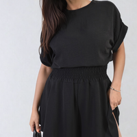Black roll-sleeve top and elastic shirred waist shorts co-ord set