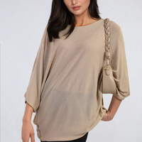 Oversized beige round-neck top with studded speckle detail, cuffed three-quarter sleeves