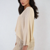 Oversized cream round-neck top with small studded dot detail