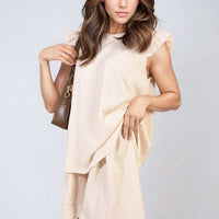 Light cream ruffle-sleeve top and matching shorts set with short layered hem