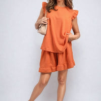 Orange ruffle-trim short-sleeve top and matching shorts set with ruffled shoulders
