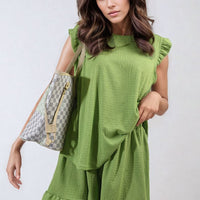 Green ruffle-trim sleeve top and tiered shorts set, sleeveless relaxed fit.