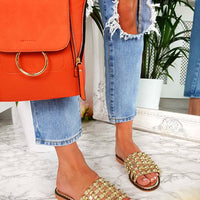 Nude flat slide sandals with studded lattice straps, open toe and low sole