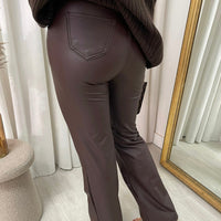 Brown faux leather high-waist trousers with straight legs and front pocket detail