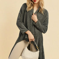 Dark grey open-front long knitted cardigan, long sleeves, roomy draped fit.