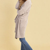 Light grey open-front long knitted cardigan, relaxed fit with side drape, long sleeves.