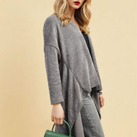 Light grey open-front long knitted cardigan with draped hem and long sleeves