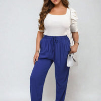 Royal blue high-waist drawstring trousers with side pockets and gathered waist