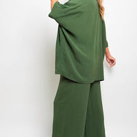 Green wide-leg trousers with drawstring gathered waist and relaxed drape