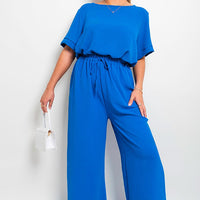 Royal blue wide-leg trousers with gathered drawstring waist, full-body view