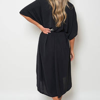 Black button-down collared midi dress with belt tie and two front pockets (back)