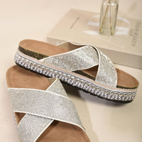 White diamante platform slide sandals with crisscross straps and braided trim sole